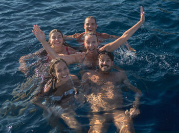 They have dived off a boat and are swimming together